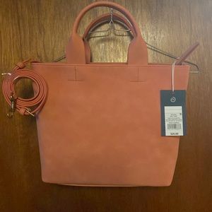 Peach purse. With detachable shoulder strap. New with tags.